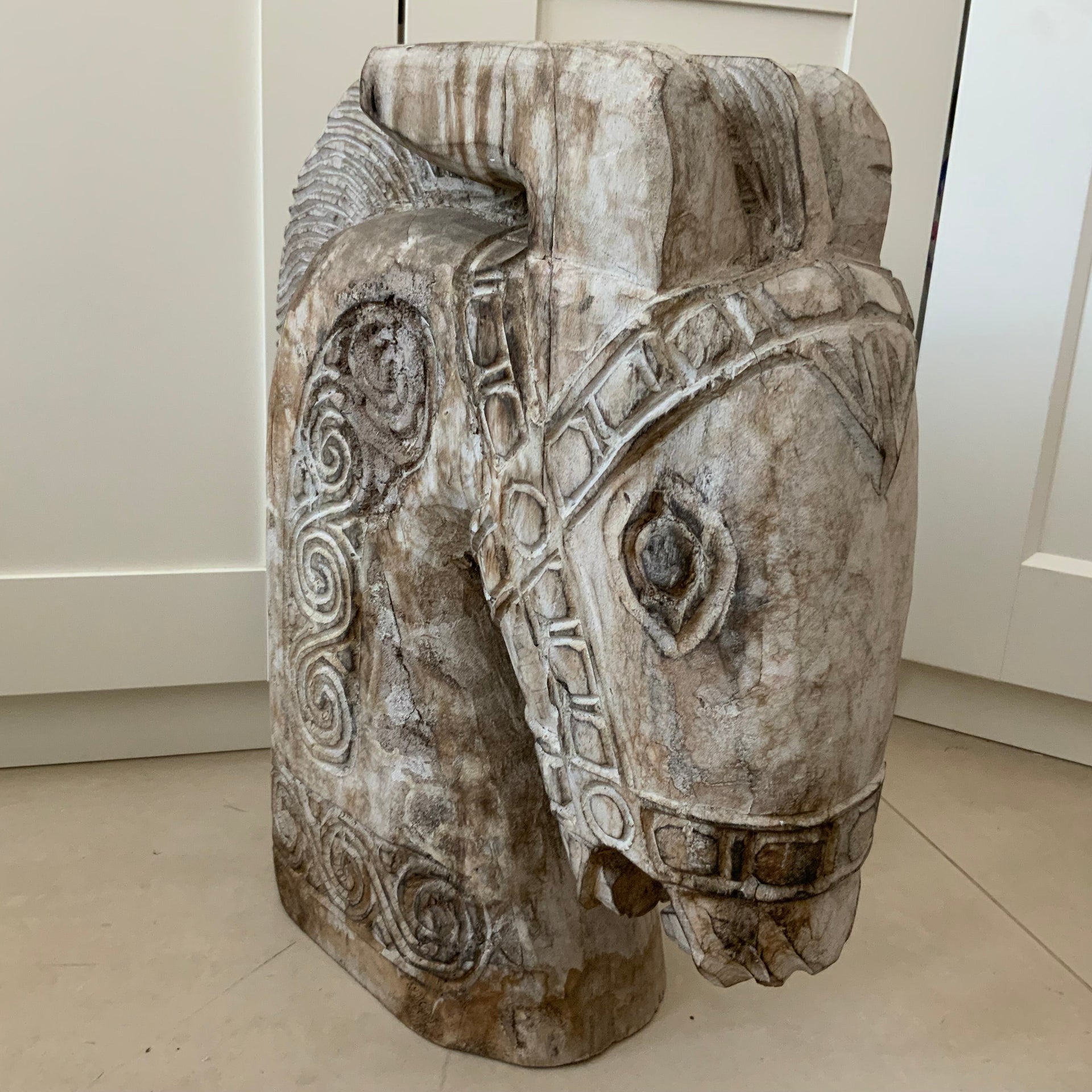 Hand-carved weathered wooden horse sculpture with spiral details, 46cm tall.