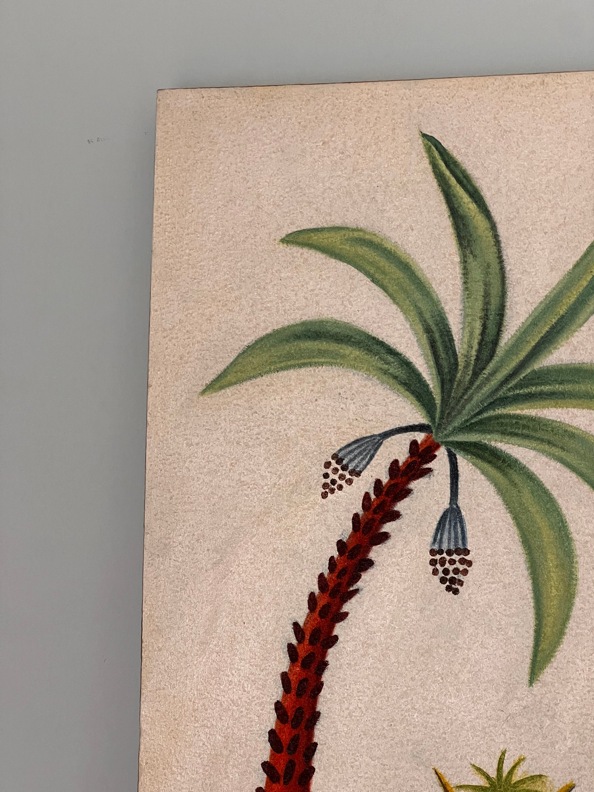 A folk art painting on canvas featuring a dark green arched door, a curved palm tree in an orange pot, and a patterned vase on a red decorative floor border.