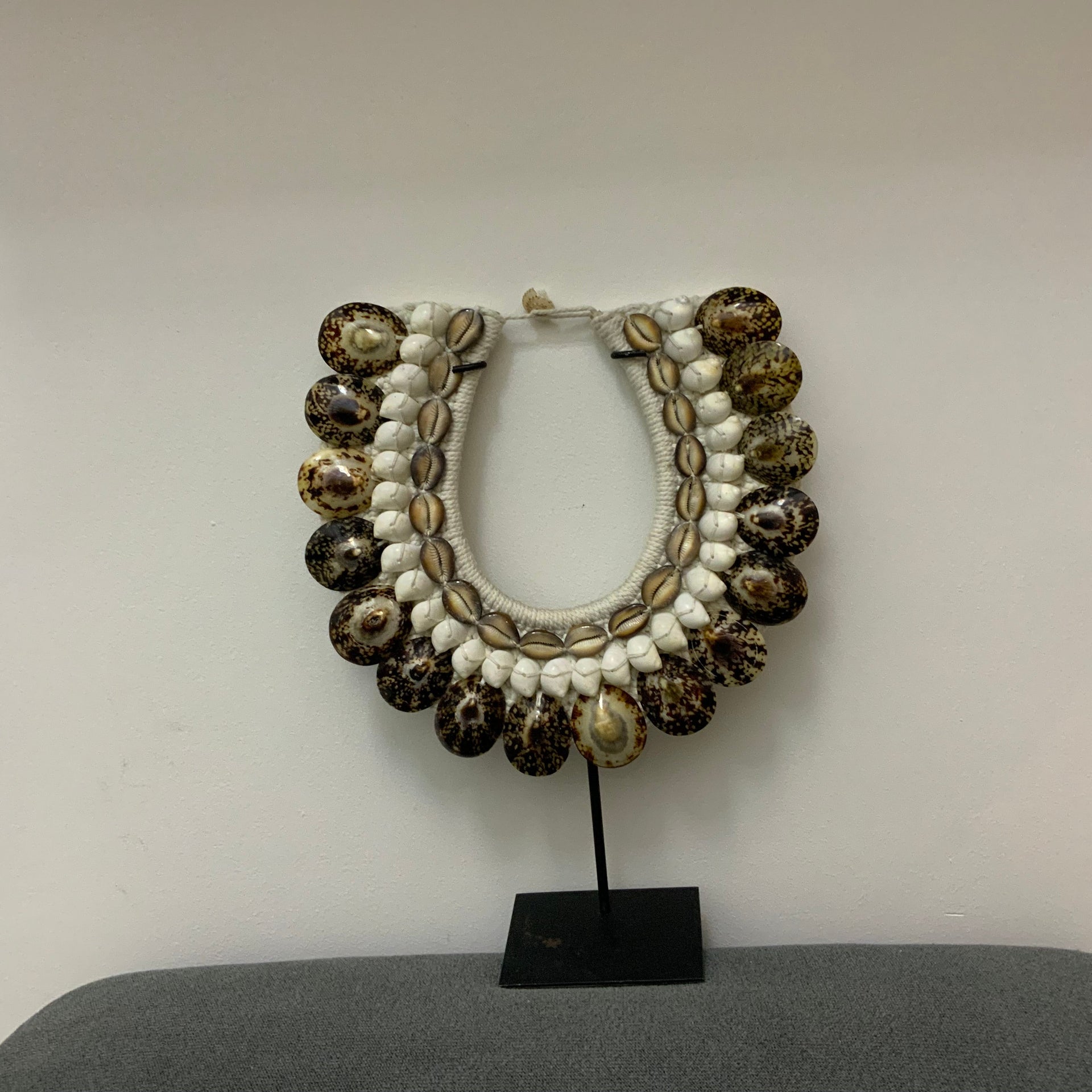 The Horizon Tiger Shell Tribal Necklace on Stand