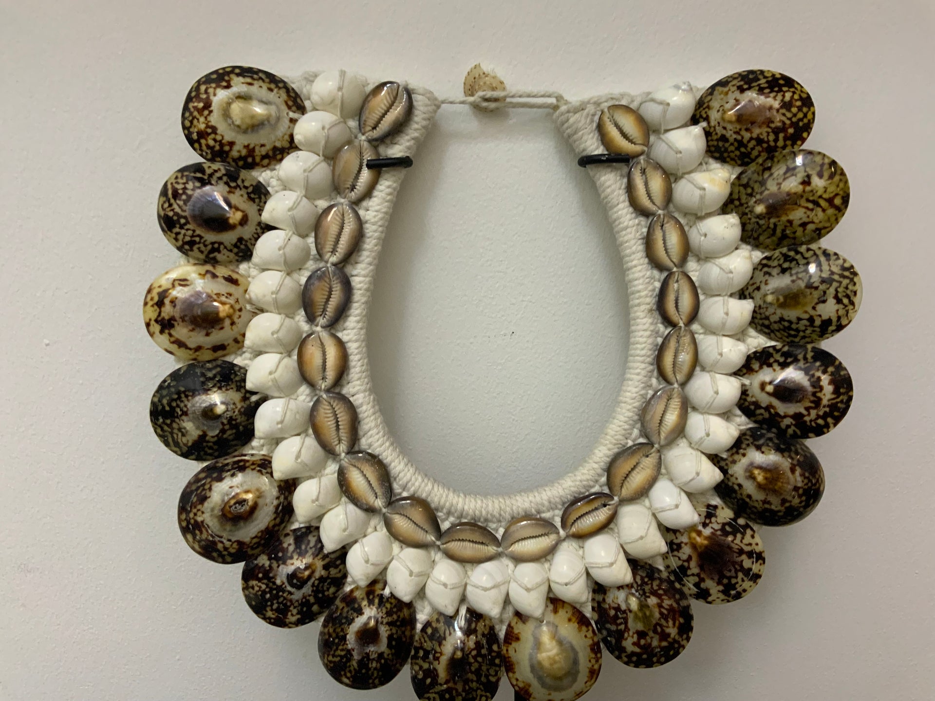 The Horizon Tiger Shell Tribal Necklace on Stand